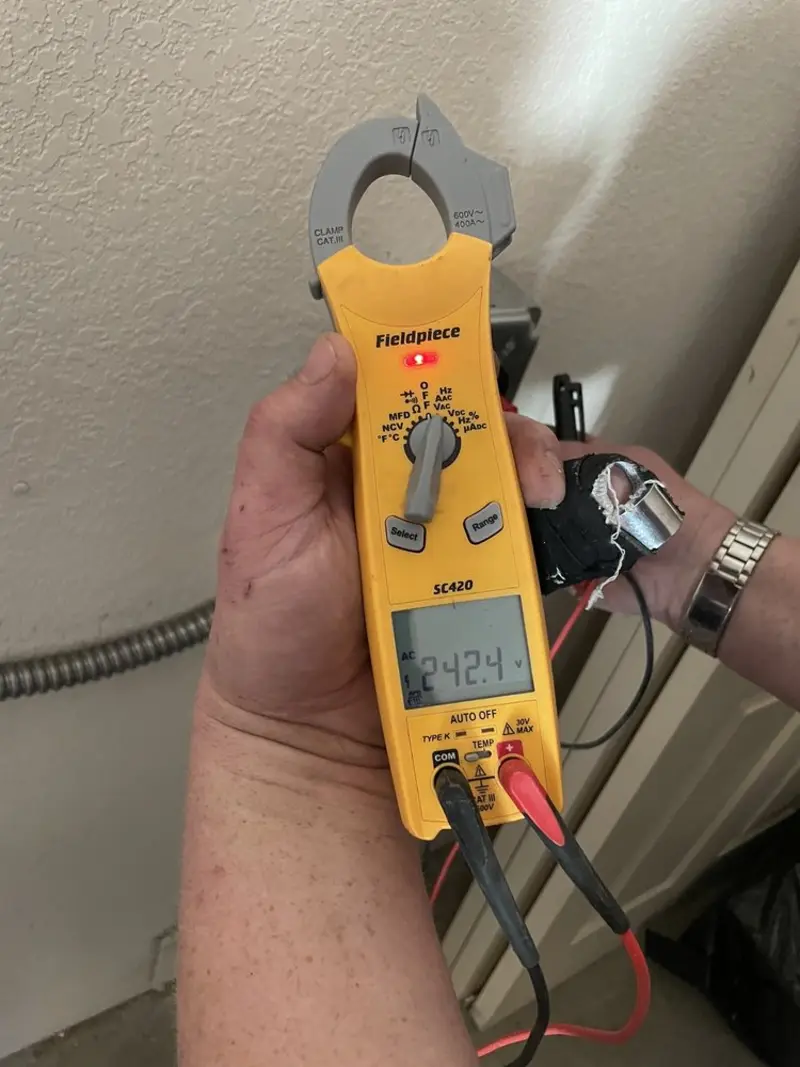 Voltage testing with clamp meter during Electrical Installation Services in Tullahoma